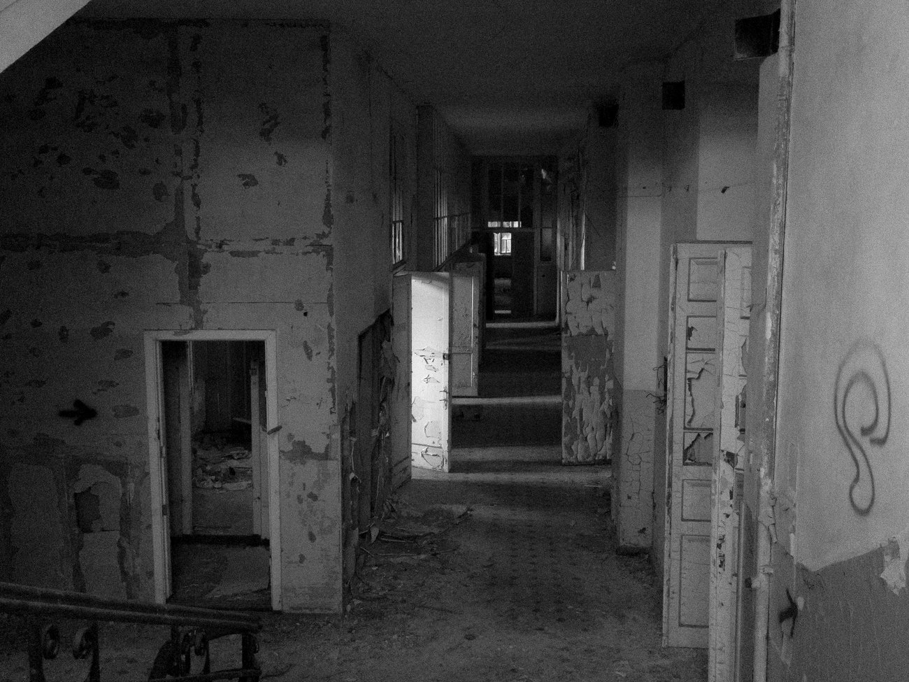 An abandoned corridor with peeling walls in Ukraine