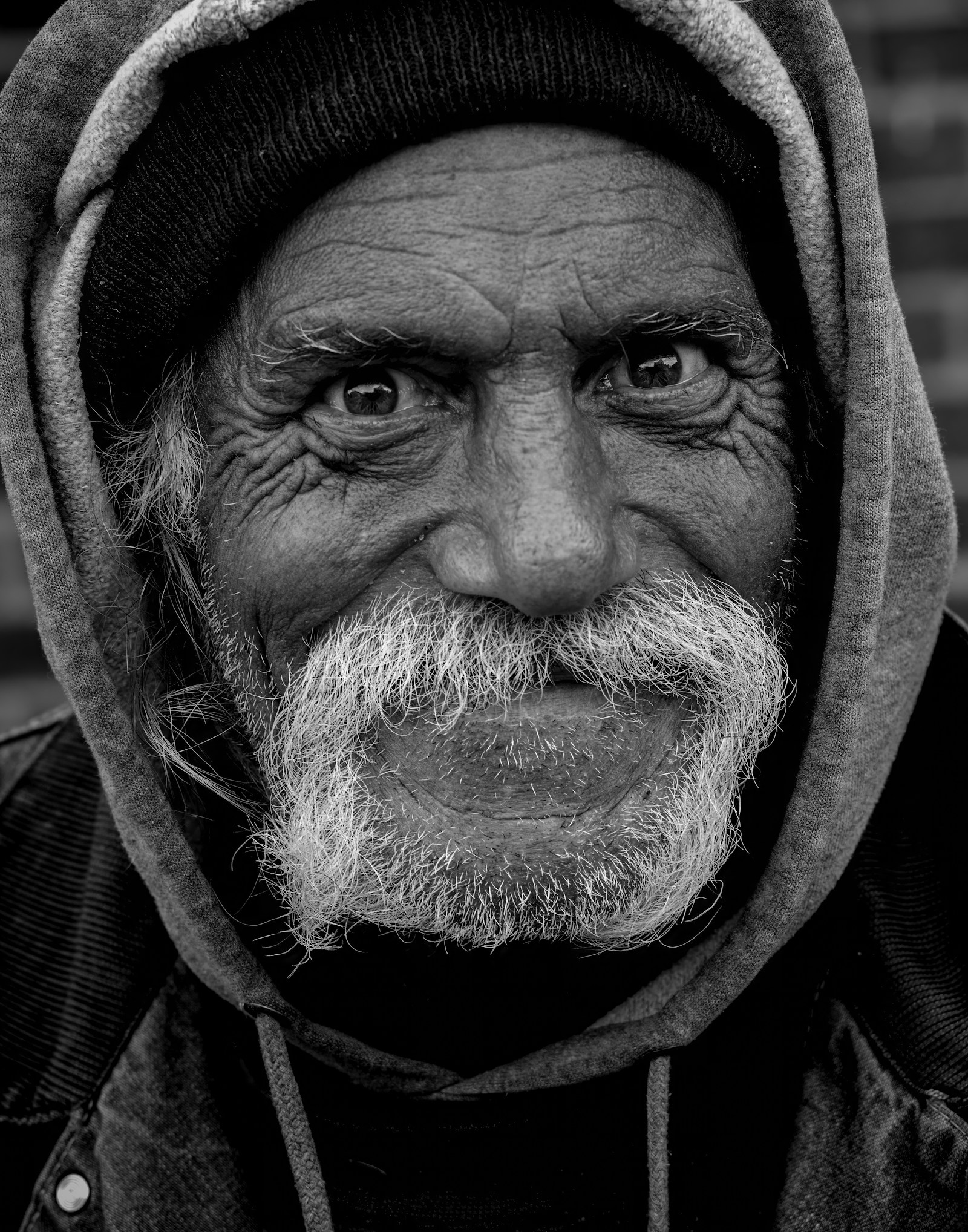 Black and white portrait of a man in a hoodie — underground producer